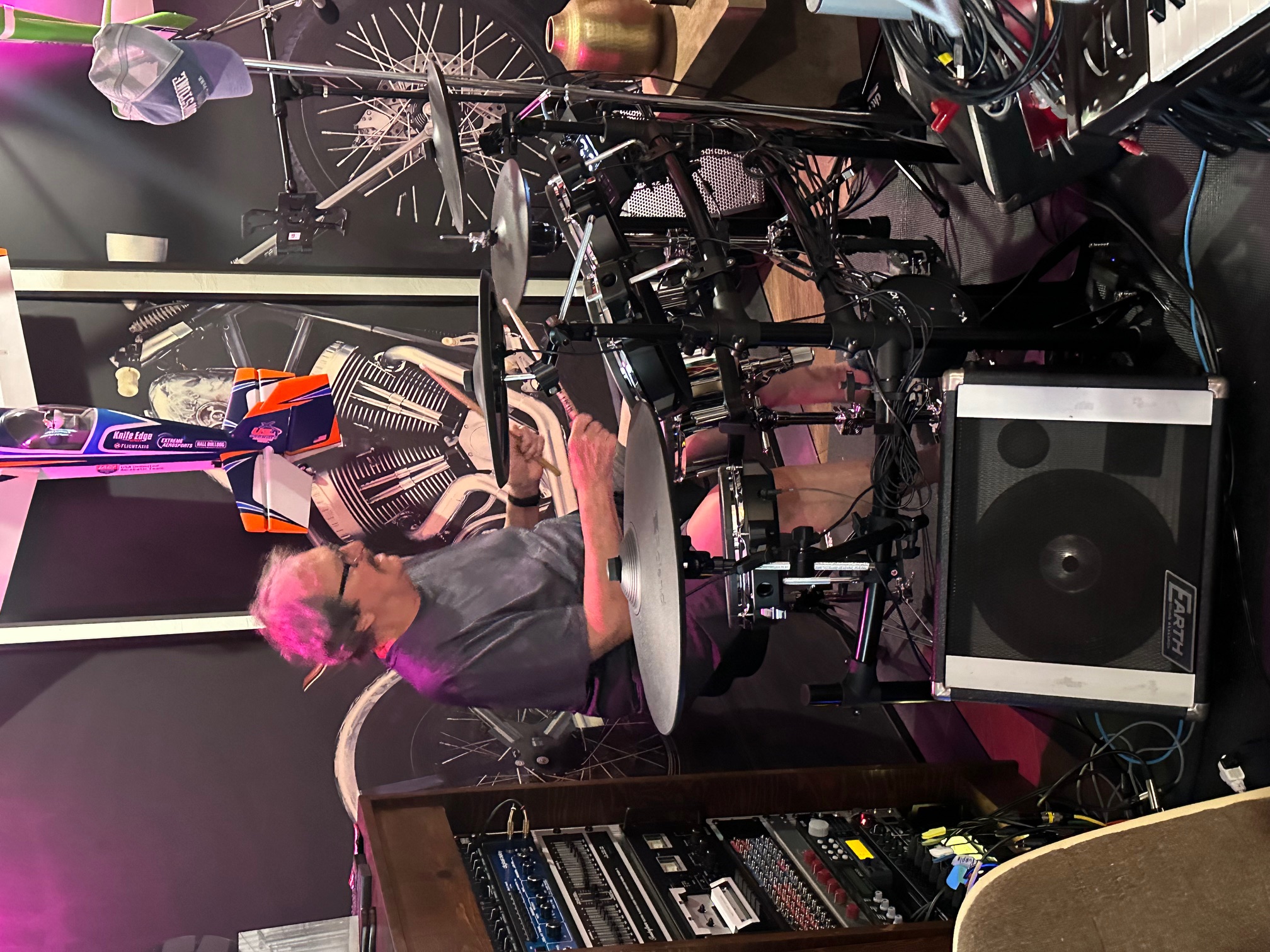 Clint playing drums in his present-day studio